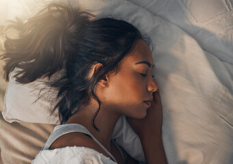 Woman, tired and sleeping in bedroom for rest, comfort and exhausted in home with blanket and...