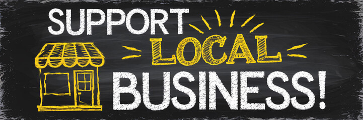 Bold "Support Local Business!" message with a yellow storefront drawing on a chalkboard background. The textured, hand-drawn elements and vibrant color contrast emphasize a strong call to action 