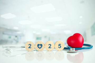 2025 Happy New Year for health care. health insurance concept, a wooden cube with 2025 text and Red...