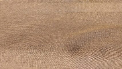 Jute hessian burlap. Brown sackcloth woven texture background in natural pattern.