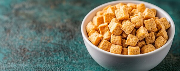 A bowl filled with golden crunchy cubes, perfect for snacks or as a garnish in various dishes, adding flavor and texture.
