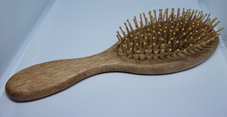 close up photo of a comb made of wood, looks natural