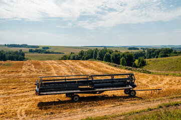 Naklejka premium combine harvester working on a field