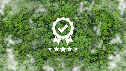 A green forest aerial view features a checkmark, five stars in mist suggesting positive environmental certification. ISO 14001 certified for environmental management systems(EMS). Quality Certificate.