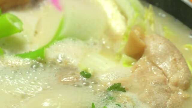 Soy milk nabe, a Japanese home-style dish of carrots, Chinese cabbage, mushrooms, and meat simmered in a pot with soy milk