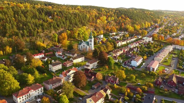 Gr&auml;nna church in Sweden, autumn colors, at sunset, aerial view. Beautiful small swedish town.