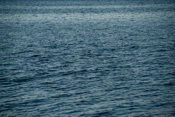Textural waves at sunset in the sea