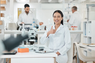 Fototapeta premium Research, thumbs up and portrait of woman in laboratory with confidence, smile and medical science. Healthcare, happy and scientist at desk with agreement, like or study in pharmaceutical engineering