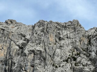 Fototapeta premium Limestone rocks in Velika Paklenica canyon,Starigrad (Paklenica National Park, Croatia) - Kalksteinfelsen in der Schlucht Velika Paklenica, Starigrad (Nationalpark Paklenica, Kroatien)