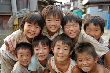 Happy group of asian children in a row smiling and looking at camera