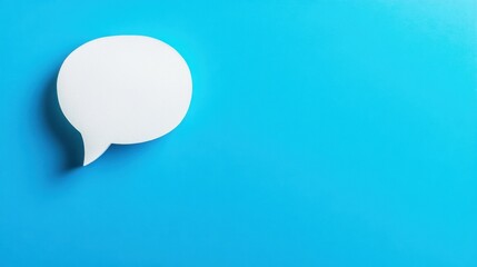 White speech bubble on a bright blue background, symbolizing conversation, interaction, and communication ideas.