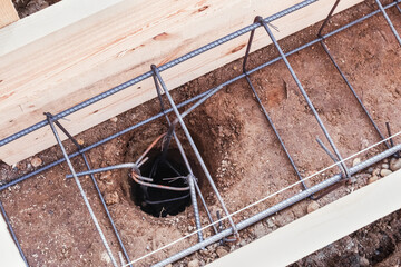 Reinforcement installed in a hole in the ground for the foundation of a building