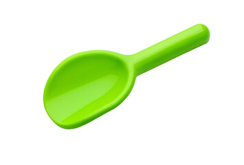 Plastic green shovel, children's toy for sand, studio shot.