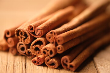cinnamon sticks on wooden background