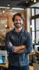 Fototapeta premium Portrait of a smiling entrepreneur in a startup office, embodying innovation and determination.
