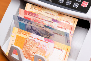 South African money in the counting machine
