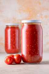 Traditional homemade canned tomatoes. Canned tomatoes prepared for winter meals