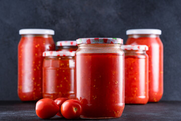 Traditional homemade canned tomatoes. Canned tomatoes prepared for winter meals