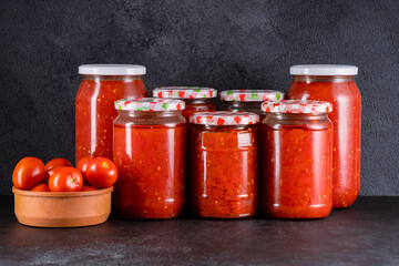 Traditional homemade canned tomatoes. Canned tomatoes prepared for winter meals