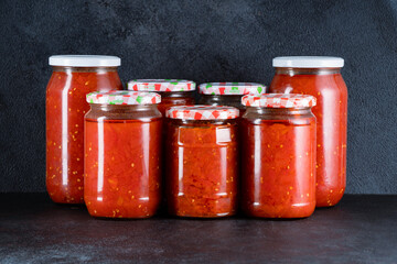 Traditional homemade canned tomatoes. Canned tomatoes prepared for winter meals