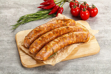 Raw sausages with spices and herbs