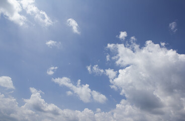 
Blue sky with puffy clouds