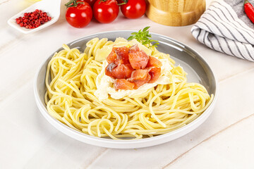 Pasta spaghetti with salmon and stracciatella