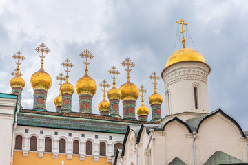 Golden domes of Upper Saviour Cathedral and Terem Churches at the Grand Kremlin Palace in Moscow.