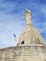 Obraz premium A statue of Jesus Christ at the mountain Urgull. San Sebastian Donostia, the Basque country, Spain