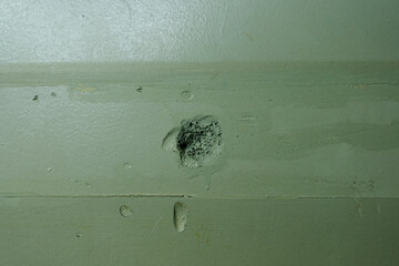 アスファルトの壁の表面　穴が開き削れた古い壁のテクスチャー背景壁紙　グランジ・汚れた壁の表面