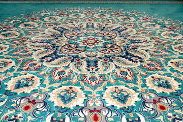 Detail of color and geometric shapes on a carpet