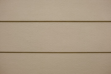 Fototapeta premium 凸凹の飾りのついたコンクリートのざらざらの壁のテクスチャー背景壁紙 穴の開いたアスファルトの壁・天井