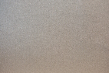 凸凹の飾りのついたコンクリートのざらざらの壁のテクスチャー背景壁紙　穴の開いたアスファルトの壁・天井