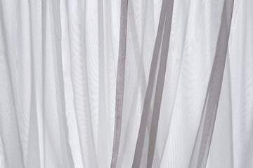 Obraz premium 光 太陽の日光日差しが差し込む布のカーテンの凹凸と影 テクスチャー背景壁紙