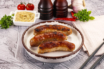 Delicous natural roasted sausages in the plate