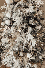 Christmas tree branches with decorations, balls, garlands, bokeh. Postcard with space for text. Merry christmas card. Winter holiday theme. Happy New Year.