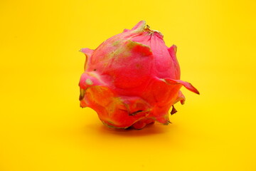 a dragon fruit isolated on yellow background