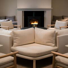 A modern living room in scandinavian style with a fireplace, a large sofa, and a wooden coffee table. The room has a neutral color scheme with warm lighting