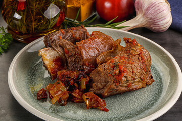 Baked beef ribs with vegetables