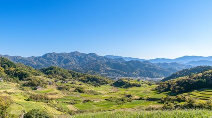 Fototapeta premium Serene Beauty of Ancient Japanese Valley: Traditional Farmhouses Nestled Among Majestic Mountains and Clear Blue Sky
