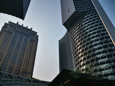 SINGAPORE - OCTOBER 20, 2024: Ground-level perspective view of contemporary skyscrapers or modern tower buildings.