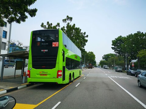 Singapore, Singapore - March 20, 2024: Singapore SBS Transit, SMRT Buses and Tower Transit Double Decker Bus MAN A95 and Volvo B9TL on Singapore roads.These buses are reliable for public transport bus