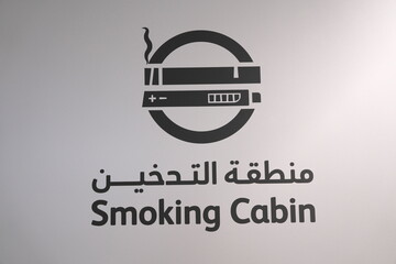 UAE - October 1, 2024: Sign or information board written in Arabic and English at an airport in Middle east