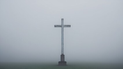 Misty Landscape with Cross in Foggy Surroundings.