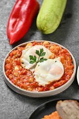 Shakshuka with Poached Eggs and Fresh Vegetables