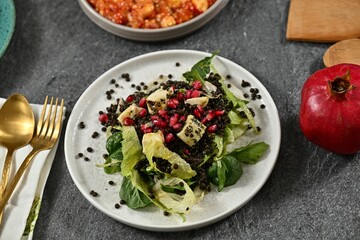 Fresh salad with lentils and pomegranate.