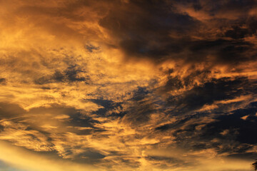 sunset with clouds over  the village in india