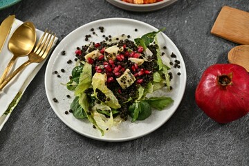 Gourmet salad with lentils and pomegranate.
