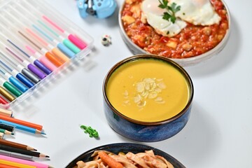 Delicious creamy soup and shakshuka