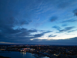 Naklejka premium Aerial View of Illuminated Southampton Docks and Port City Centre During Dark Night. England United Kingdom. High Angle Drone's Camera Footage Captured from High Altitude on May 5th, 2024